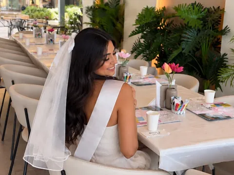 Bride-to-be at a table set for a VIBEZ bridal shower