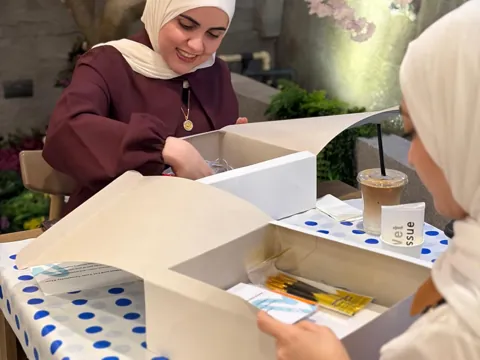Guests opening their VIBEZ kit boxes