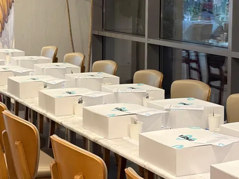 Long table set with VIBEZ kit boxes for a corporate workshop