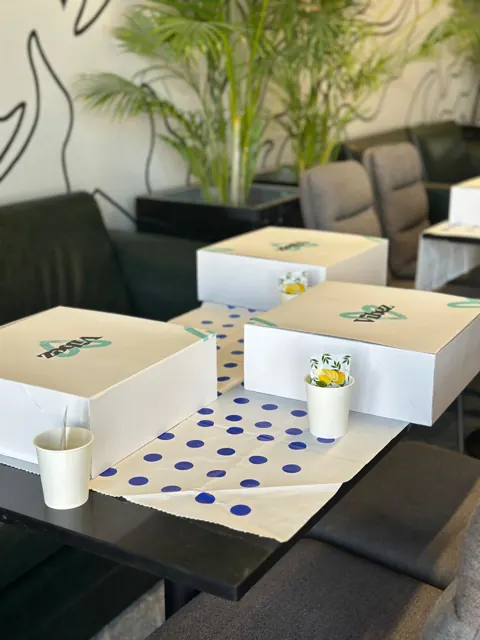 Vibez supply boxes set up on café tables before a session